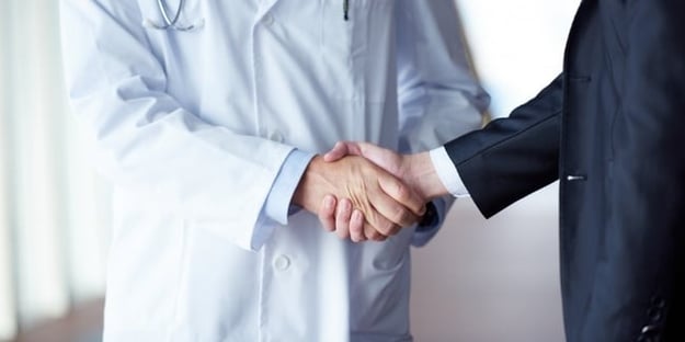 doctor handshake with a patient at doctors bright modern office in hospital-350893-edited.jpeg