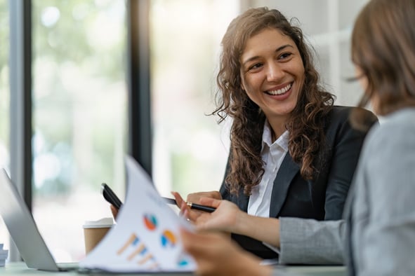 female-european-adult-business-office-analyzing-chart-with-colleagues-print