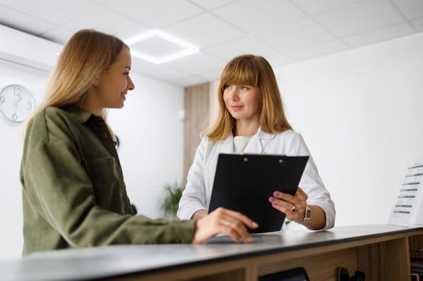 female-european-adult-doctor-reception-talking-with-patient-print
